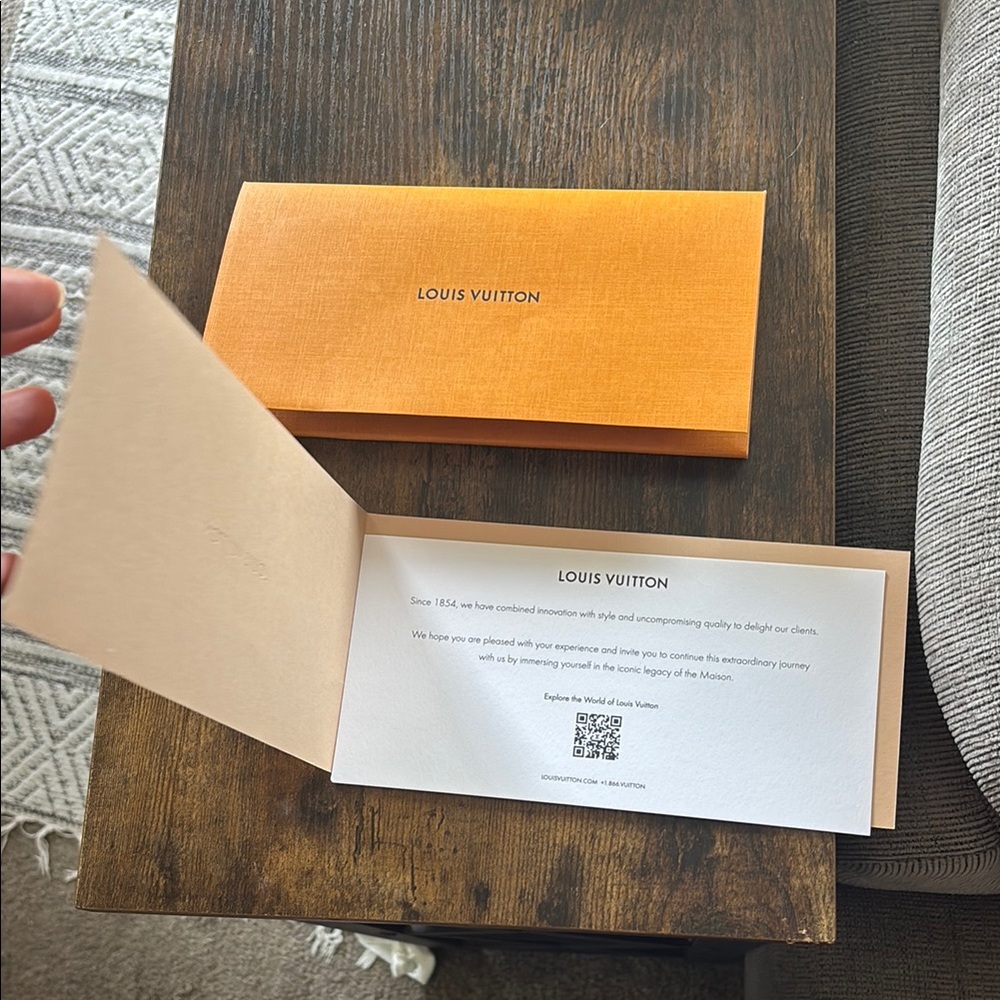Authentic Louis Vuitton receipt slip and holder.